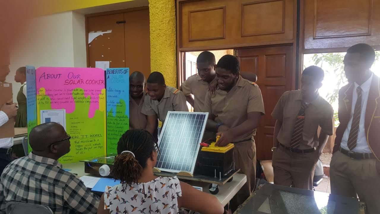 Cornwall College students presenting a solar cooker project